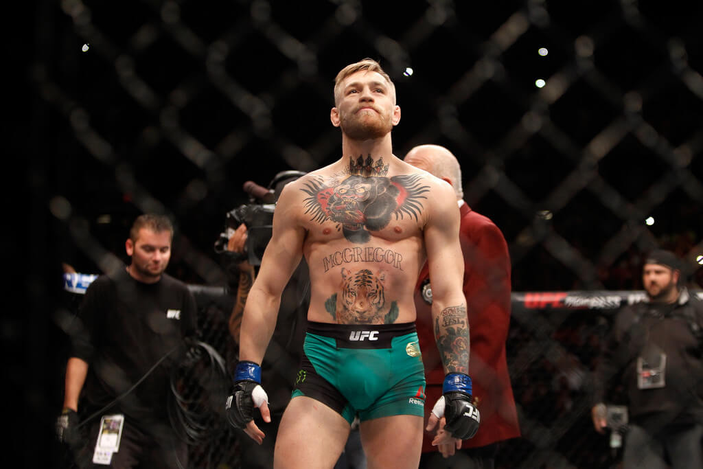 Conor McGregor scores a first-round KO victory against Jose Aldo at UFC 194