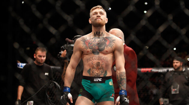 Conor McGregor scores a first-round KO victory against Jose Aldo at UFC 194