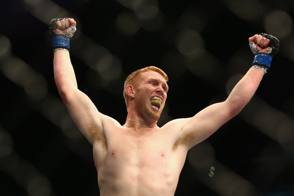 Sam Alvey of the USA celebrates victory over Dylan Andrews
