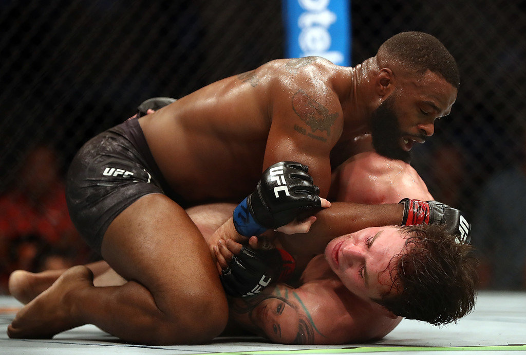 Tyron Woodley, top and Darren Till in their UFC Welterweight Title bout during UFC 228