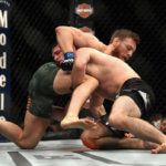 Khabib Nurmagomedov attempts a takedown against Conor McGregor at UFC 229