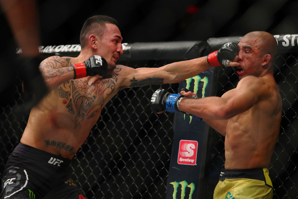 Max Holloway jabs Jose Aldo with a left hand