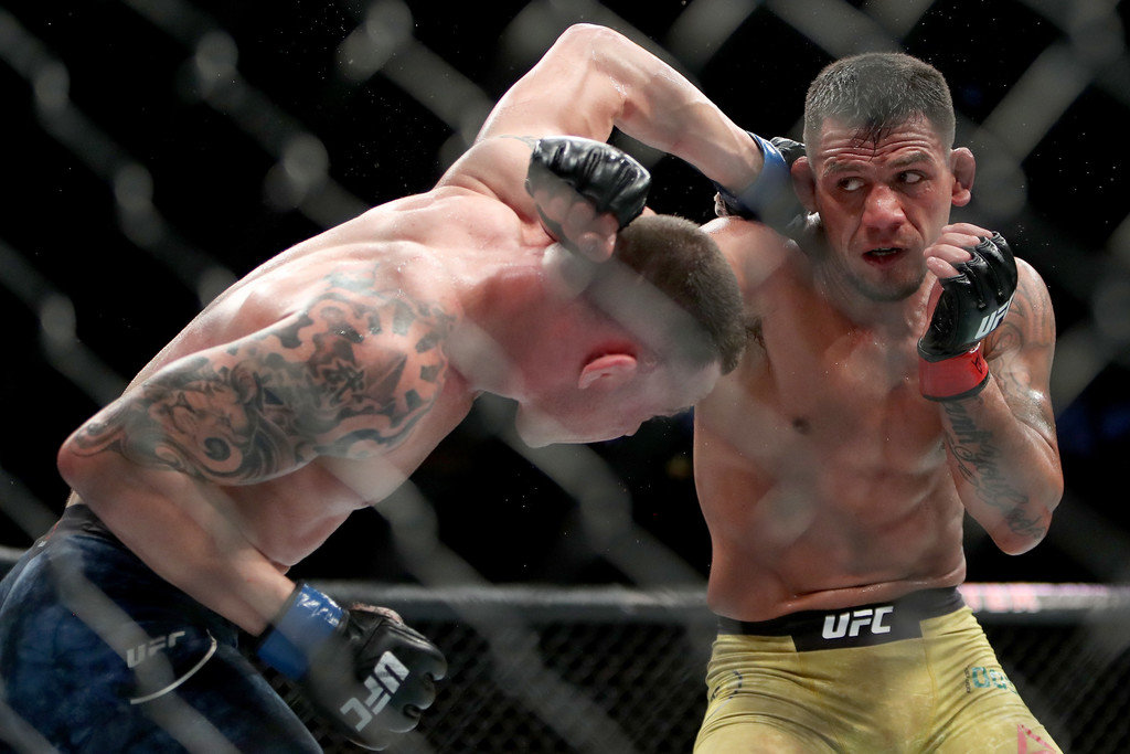 Rafael Dos Anjos and Colby Covington exchange punches at UFC 225