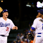 Joc Pederson #31 of the Los Angeles Dodgers celebrates with Justin Turner #10 after defeating the Houston Astros 3-1