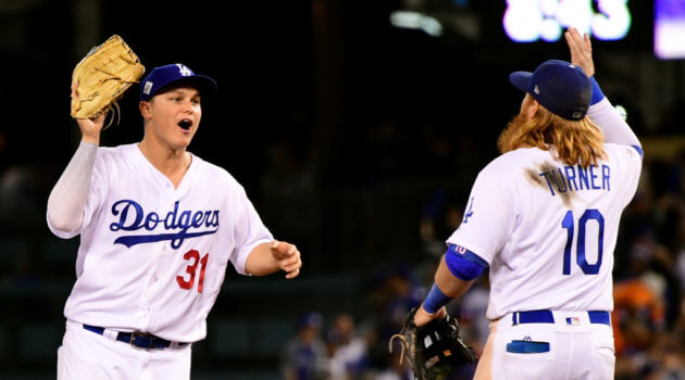 Joc Pederson #31 of the Los Angeles Dodgers celebrates with Justin Turner #10 after defeating the Houston Astros 3-1
