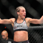 Joanna Jedrzejczyk raises her hand after her fight at UFC 223
