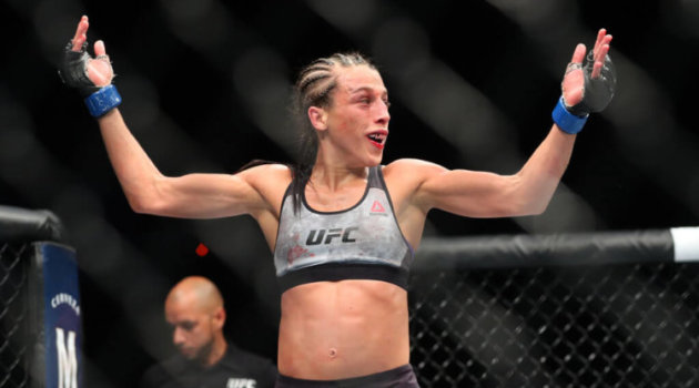 Joanna Jedrzejczyk raises her hand after her fight at UFC 223