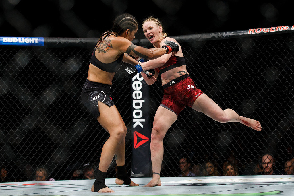 Valentina Shevchenko rips a left kick into the leg of Amanda Nunes at UFC 215