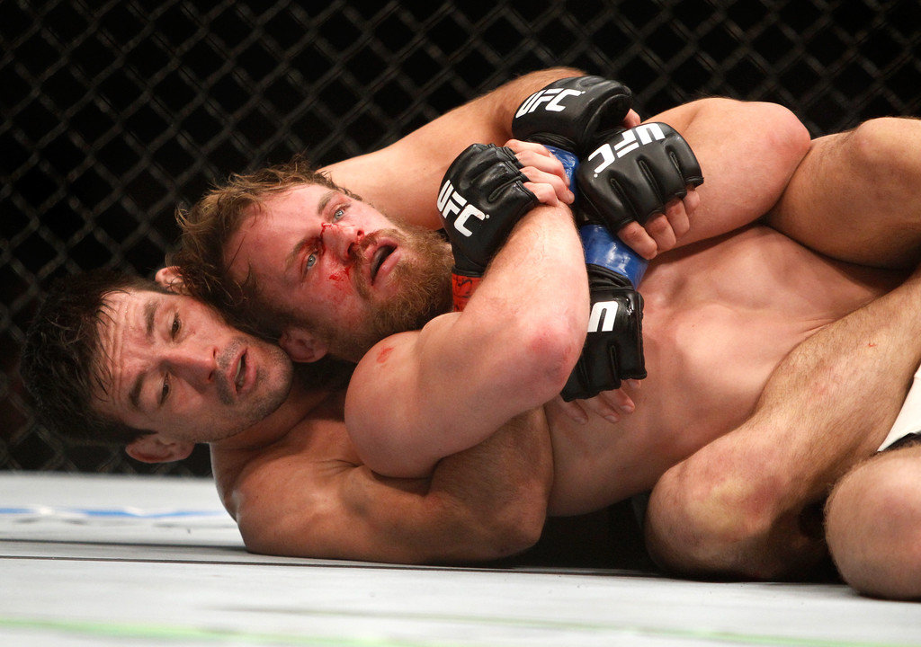 Demian Maia (L) wrestles with Gunnar Nelson in a welterweight fight
