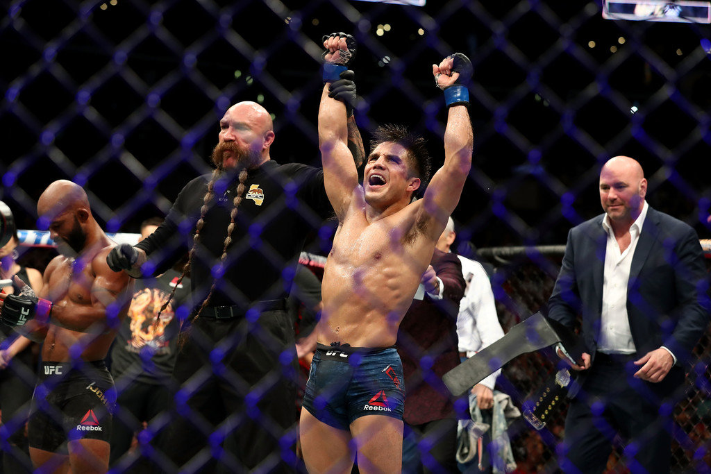 Henry Cejudo celebrates after winning at UFC 227