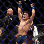 Henry Cejudo celebrates after winning at UFC 227