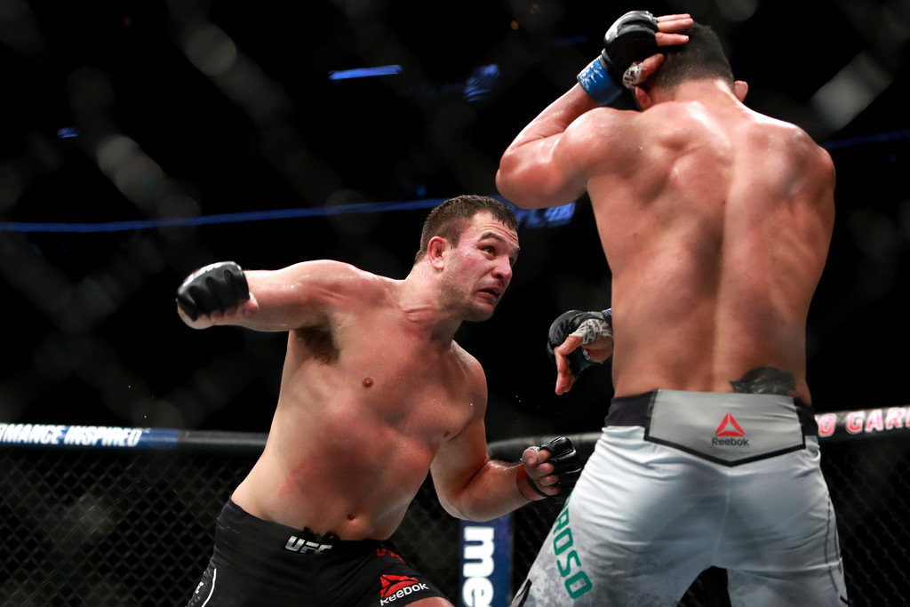 Gian Villante throws a punch against Francimar Barroso in their Light Heavyweight fight during UFC 220 