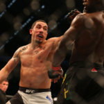 Robert Whittaker of New Zealand (L) and Uriah Hall of Jamaica compete in their middleweight bout during the UFC 193