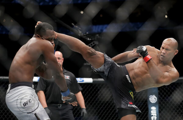 Ronaldo Souza throws a kick against Derek Brunson