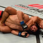Kevin Lee sinks in the rear-naked choke