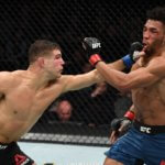 Al Iaquinta tags Kevin Lee with a left hand