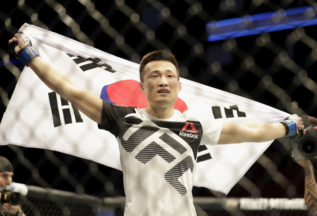 Chan Sung Jung of South Korea celebrates after defeating Dennis Bermudez in their featherweight bout during the UFC Fight Night event at the Toyota Center on February 4, 2017 in Houston, Texas.