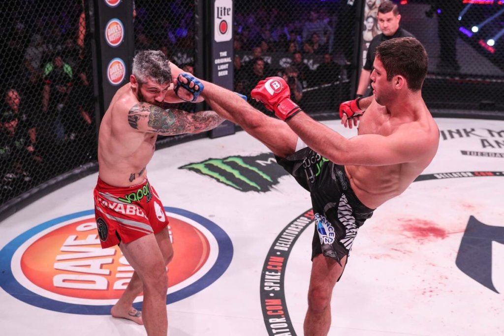 Neiman Gracie goes high with a right kick in Bellator