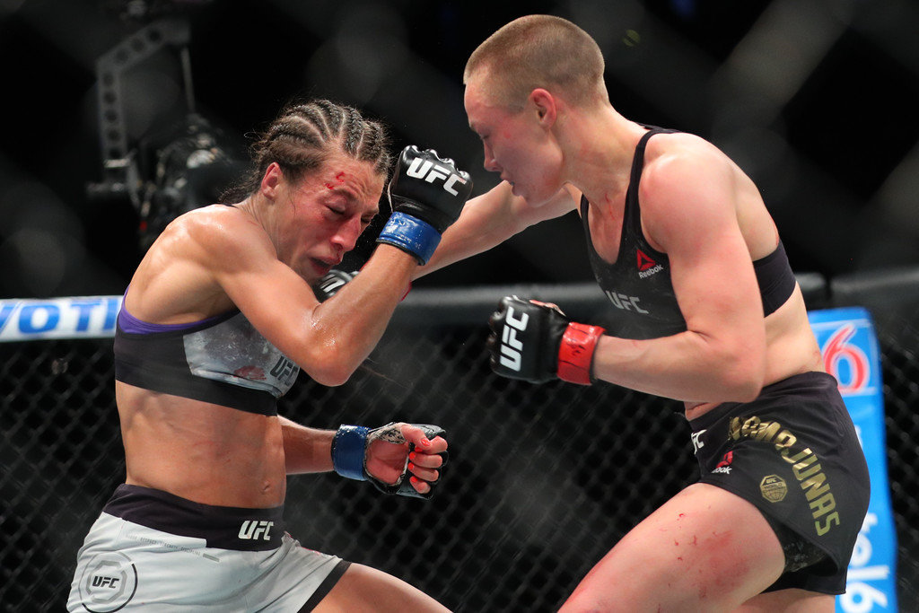 Rose Namajunas strikes Joanna Jedrzejczyk at UFC 199