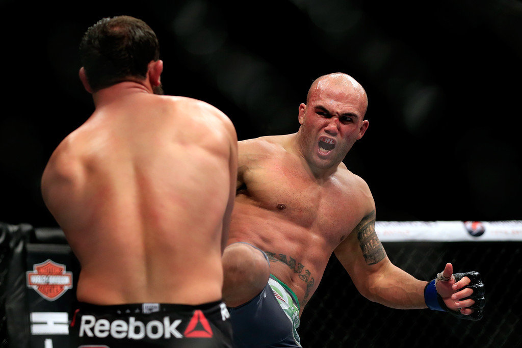 Robbie Lawler kicks Johny Hendricks in their welterweight title fight during the UFC 181 event