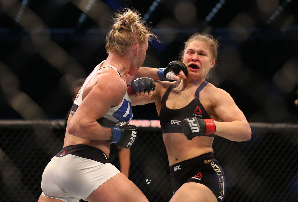 Holly Holm tags Ronda Rousey with a left hand