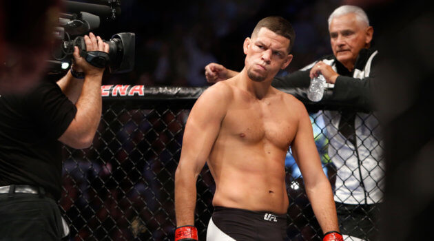 Nate Diaz eyes Conor McGregor from across the Octagon before their welterweight rematch
