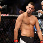 Nate Diaz eyes Conor McGregor from across the Octagon before their welterweight rematch