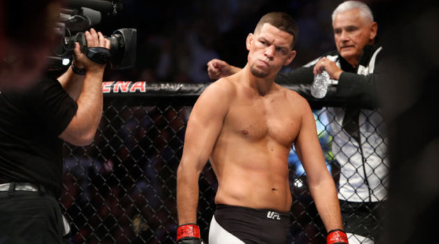 Nate Diaz eyes Conor McGregor from across the Octagon before their welterweight rematch