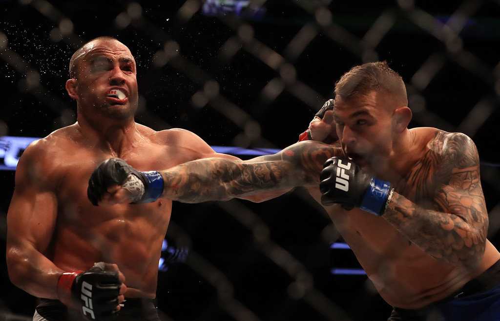 Eddie Alvarez fights against Dustin Poirier in their Lightweight bout during UFC 211 at American Airlines Center on May 13, 2017 in Dallas, Texas.